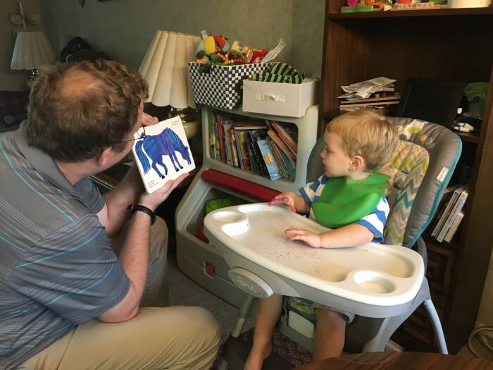 Reading a book to my son after dinner.