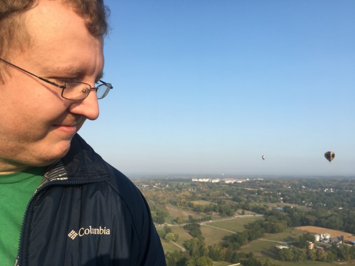 Me, looking at the ground with two other balloons in the background.