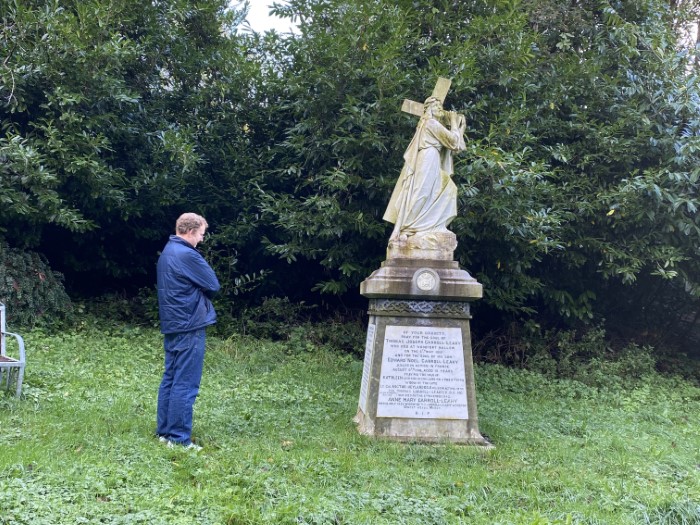 Me reading the names on one of the markers at the Site of Kilpadder Church.